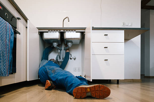 Professional Emergency Plumber technician working in Madisonville, TX
